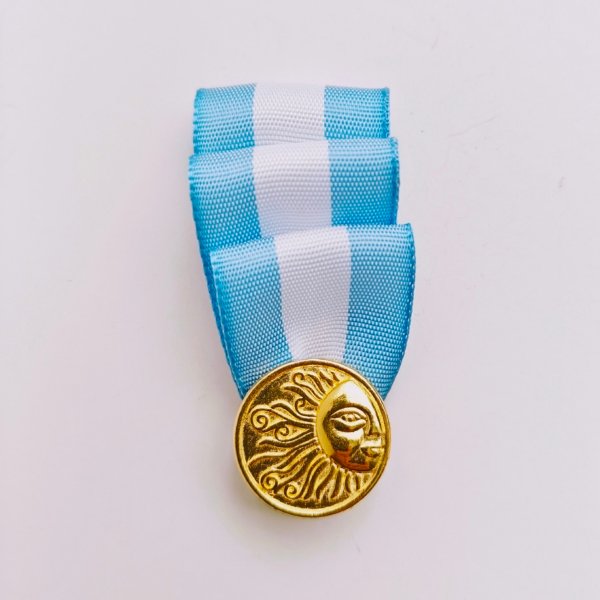 Escarapela Plumín Dorado